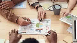 Hands going through a report
