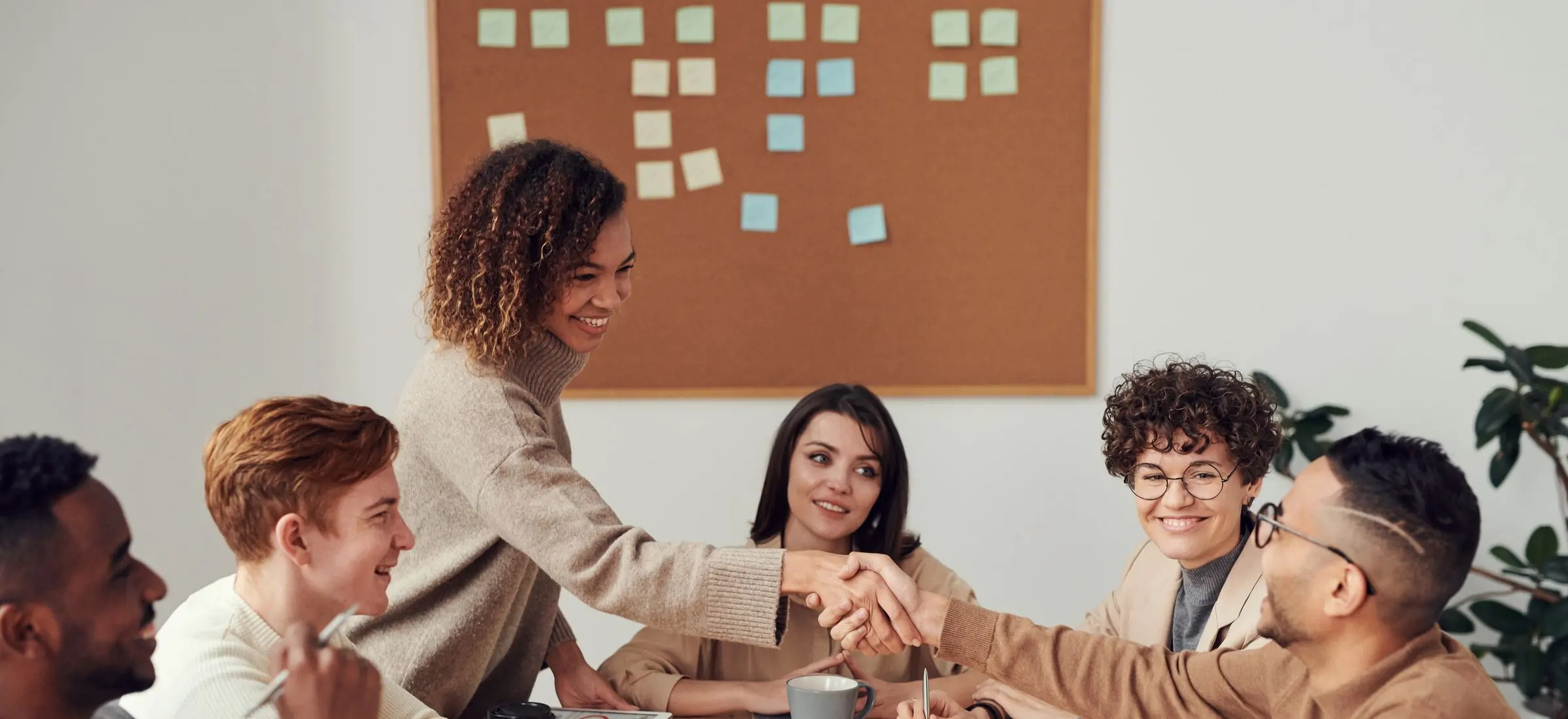 A team in a working session around a meeting table